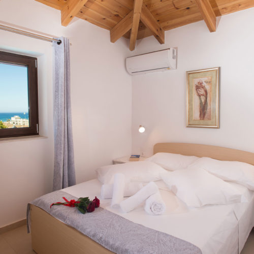 Levanta Apartment bedroom with sea view – Houmeli Apartments, Kalamaki Crete.