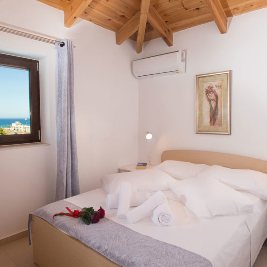 Levanta Apartment bedroom with sea view – Houmeli Apartments, Kalamaki Crete.