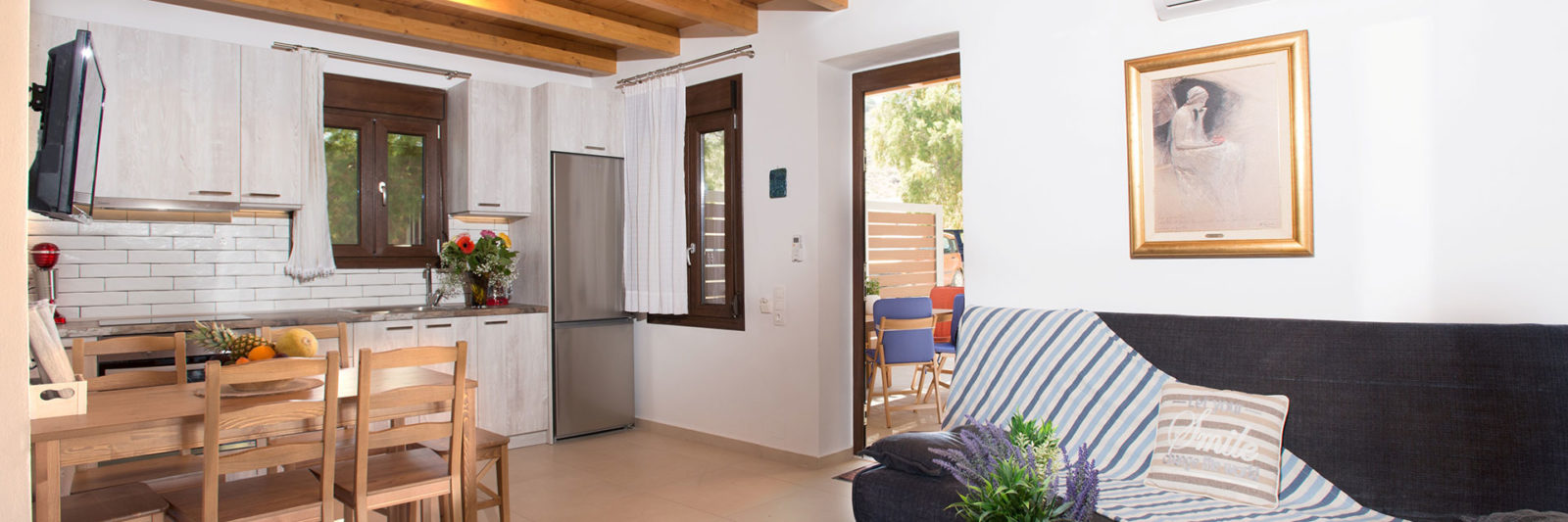 Louisa Apartment kitchen and living area – Houmeli Apartments, Kalamaki Crete.