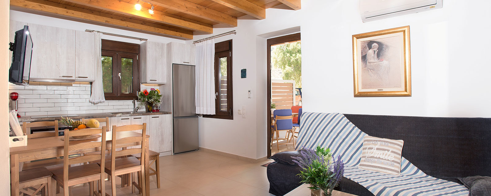 Louisa Apartment kitchen and living area – Houmeli Apartments, Kalamaki Crete.
